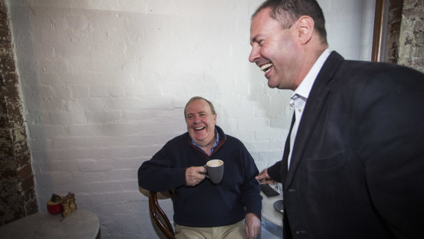 Newly-appointed deputy Liberal leader and federal Treasurer Josh Frydenberg, right, shares a coffee and a laugh on Saturday morning with former treasurer Peter Costello.