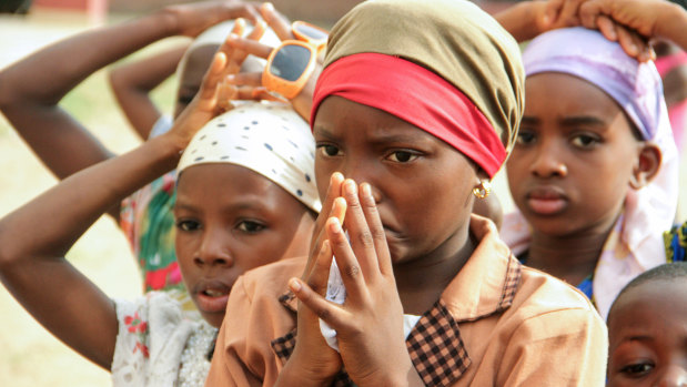 Children pray as Christian community members take part in a protest against the killing of people by suspected herdsmen in Makurdi, north-central Nigeria in April.