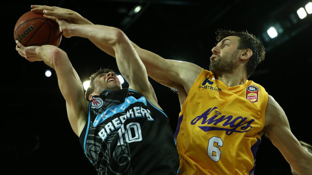 King of the court: Andrew Bogut blocks the Breakers' Thomas Abercrombie.