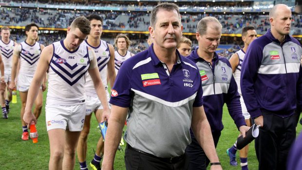 Ugly incident: Fremantle coach Ross Lyon leads his team off the field after loss to West Coast that was blighted by Andrew Gaff's hit on young Docker Andrew Brayshaw.