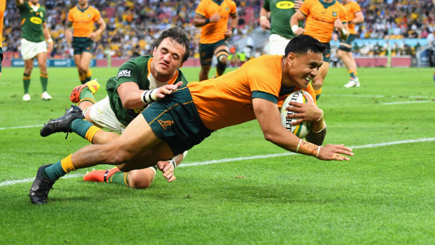 Len Ikitau scores a try against the Springboks on Saturday. 