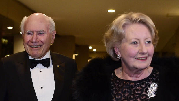 John and Janette Howard arrive at the club for his 80th birthday party on July 26.