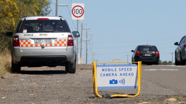 The Auditor-General says the warning signs limit the ability of cameras to act as a deterrence to motorists speeding. 