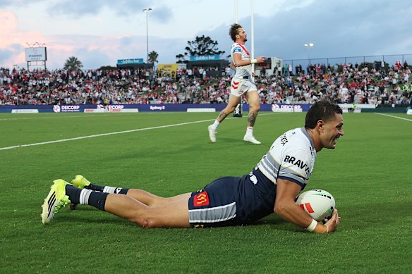 Braidon Burns scores a try for the Cowboys.