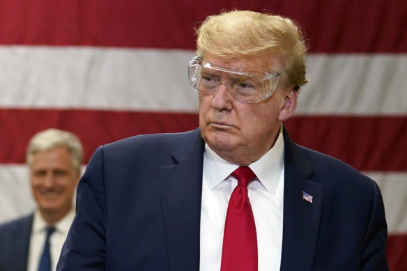US President Donald Trump, wearing safety glasses but no mask, tours a Honeywell International factory making face masks in Phoenix, Arizona, on Tuesday.