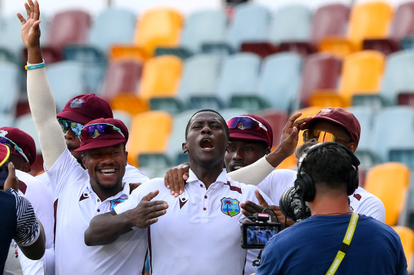 Shamar Joseph celebrates with teammates at the Gabba.