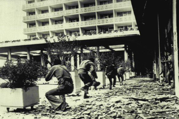 Gunmen by the pool at the Phoenicia fire at opponents in the nearby Holiday Inn in the first year of civil war in 1975.