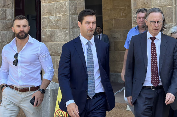 Cameron Waugh (centre) leaving Stirling Gardens Magistrates Court on Wednesday.