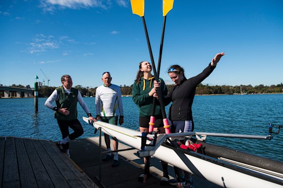 Drummoyne Rowing Club president Stephen Burke, left, with club patron Graham Wearne and rowers Amelia Cassidy and Emma Malka on the pontoon.