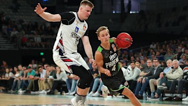 Fleet-footed: Kyle Adnam breaks forward for Phoenix.