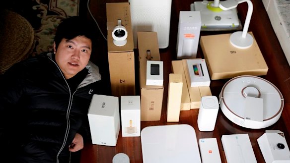 Superfan Pan Weida, 31, shows off some of his Xiaomi gear.