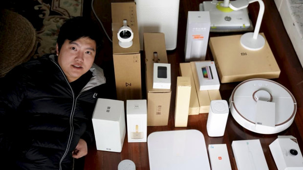 Superfan Pan Weida, 31, shows off some of his Xiaomi gear.