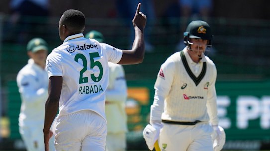 South Africa’s Kagiso Rabada, centre, celebrates the wicket of Australia’s Nic Maddinson, right, on day four.