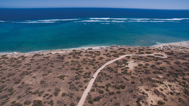 Ningaloo, one of the world’s largest fringing coral reefs, which abuts the rugged Cape Range and has been described by author Tim Winton as one of the last intact wild places on the planet.