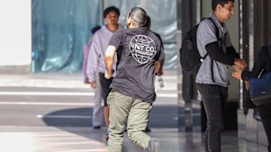 Sacked transport official Ibrahim Helmy runs from the Downing Centre on Thursday after his sentencing.