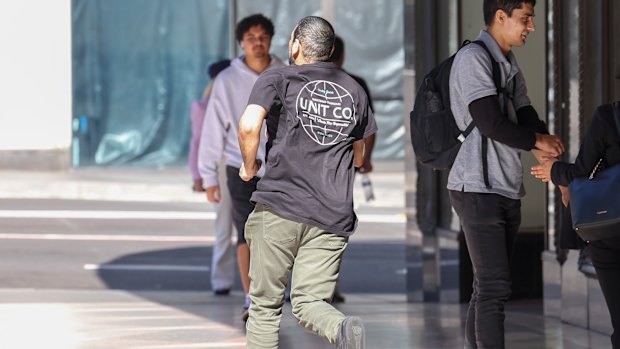 Sacked transport official Ibrahim Helmy runs from the Downing Centre on Thursday after his sentencing.