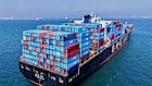 A container ship sails off from a container terminal in Qingdao in China’s Shandong province.