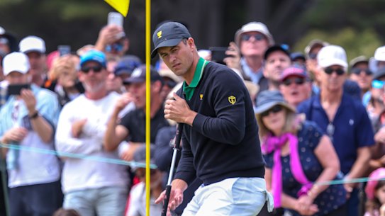Adam Scott and Louis Oosthuizen score a match point in foursomes on Friday.