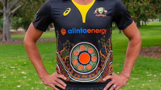Mitchell Starc models Australia's Indigenous cricket uniform.