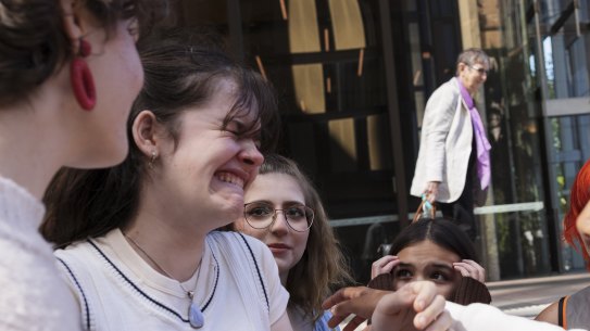 Young climate activist Luca Saunders shows her disappointment after the verdict on a climate case brought by  a group of eight children was dismissed.