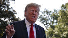 President Donald Trump talks with reporters before departing on Marine One for the Air Force Academy graduation ceremony.