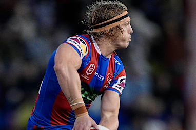 Phoenix Crossland  shapes to pass the ball in the Newcastle Knights' round 18 win over the Dolphins.