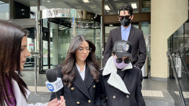 Yuteng Zhang, 32, and Jess Fang Ching Ting, 37 (both masked), leave court on Friday.