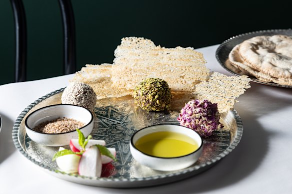 Lamb naye balls coated with sesame seeds, crushed pistachio and dried rose petals at Sama.