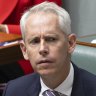 Immigration Minister Andrew Giles has deferred all decisions over the visa conditions of former detainees to departmental officials.