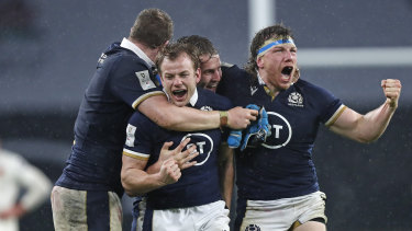 Scotland’s Hamish Watson, right, and teammates celebrate beating England at Twickenham earlier this year. 