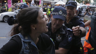 One of five people arrested as the protest group made its way through the city.