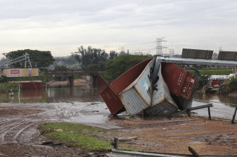 Shipping containers were carried away and left in a jumbled pile by floods in Durban, South Africa, on Wednesday.