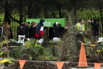 Omar Zahed’s coffin is carried to the grave site at Rookwood Cemetery. 
