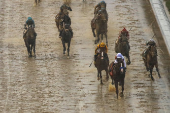 Justify claims victory in muddy conditions in the 2018 Kentucky Derby.