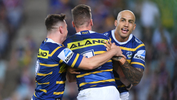 No love lost: Blake Ferguson (right) celebrates the opening try against his former side.