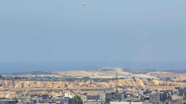 Balloons (top of the photo) carrying an incendiary device launched from the Gaza Strip drift to the Israeli side of the border between Gaza and Israel.