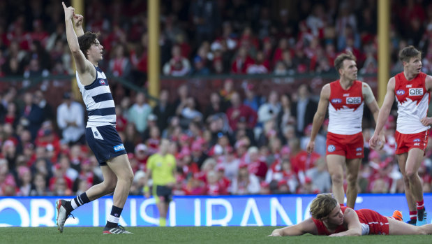 Jordan Clark celebrates a goal for AFL leaders Geelong at the SCG.