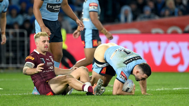 James Tedesco’s shorts fall down as Cameron Munster looks on during Origin I.