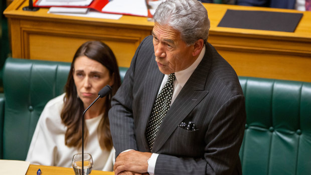 NZ Prime Minister Jacinda Ardern listens as her deputy, Winston Peters, speaks in the chamber on the first day of a new parliamentary session in Wellington.