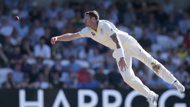 Australia's James Pattinson attempts to stop a shot by England's Joe Root.