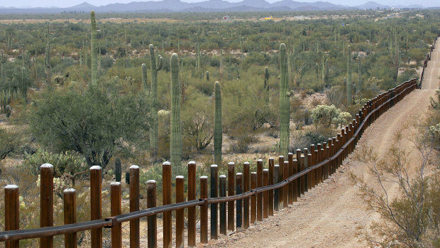 A border fence separating Mexico, left, from the US near Lukeville, Arizona.