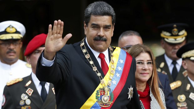 Venezuelan President Nicolas Maduro greets the media after his re-election.