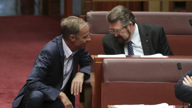 Greens senator Nick McKim discusses the bill with Derryn Hinch on Wednesday.