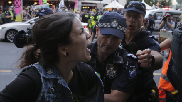 One of five people arrested as the protest group made its way through the city.