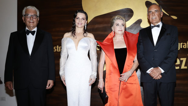 President of Venice Film Festival Paolo Baratta, Juliette Binoche, Catherine Deneuve and festival director Alberto Barbera at the opening ceremony of the 76th Venice Film Festival at Sala Casino in Venice, Italy, on Wednesday. 