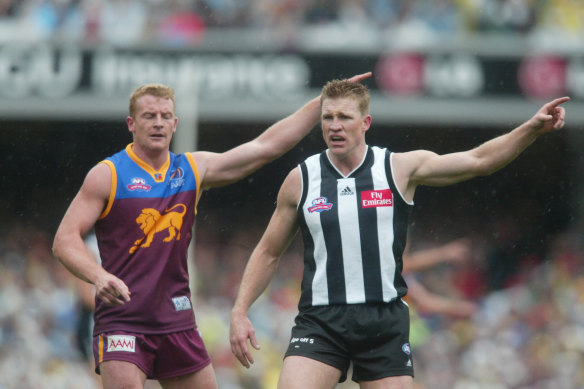 Michael Voss and Nathan Buckley during the 2002 grand final, won by Brisbane.