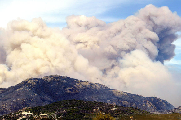 Smoke rising from the Wilsons Promontory fire that ran out of control and forced the evacuation of hundreds of trapped visitors in 2005.