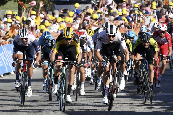 Belgium's Wout Van Aert, centre left, sprints ahead of Netherland's Cees Bol, centre right, to cross the finish line and win the fifth stage of the Tour de France cycling race over 183 kilometres.