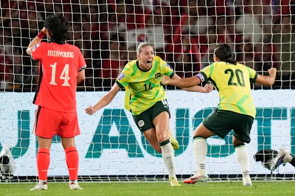 Australia’s Alanna Kennedy celebrates with Sam Kerr after scoring against South Korea.