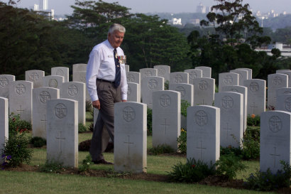 Guy Griffiths attending a dawn service at Singapore’s Kranji War Cemetery in 2002.